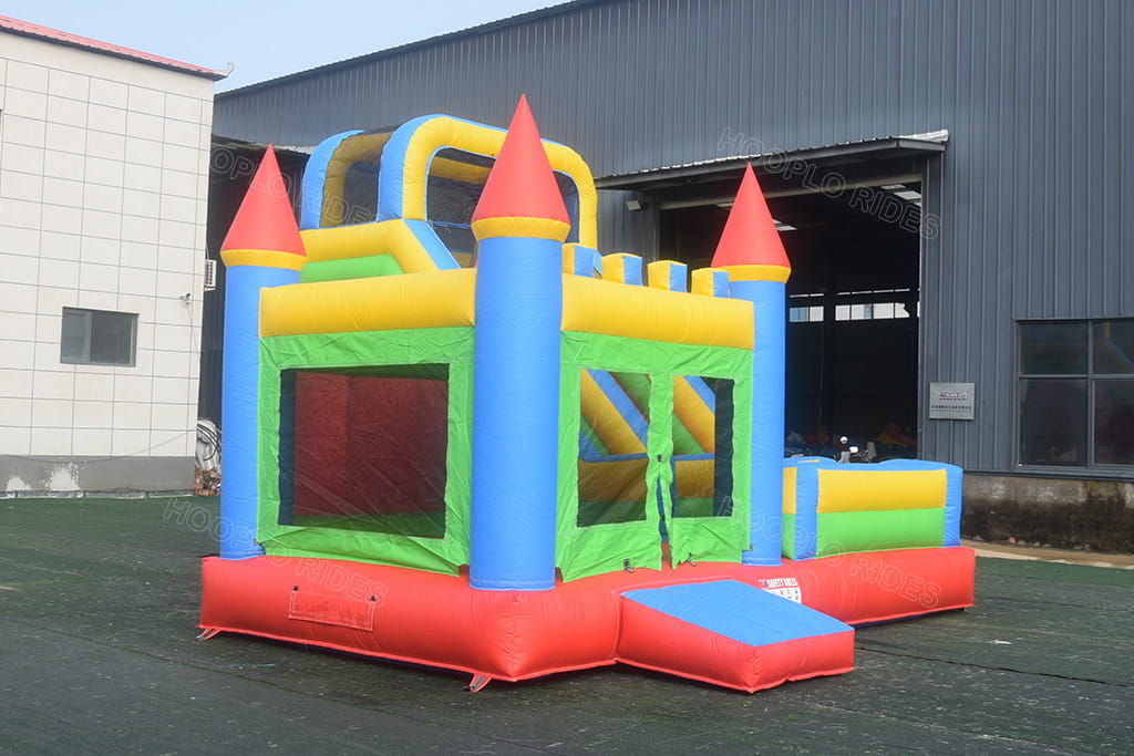 Left rear side angle shot of multicolor princess inflatable bounce house slide combo, heavy-duty colorful PVC commercial jumping castle for all kids outdoor play rental business