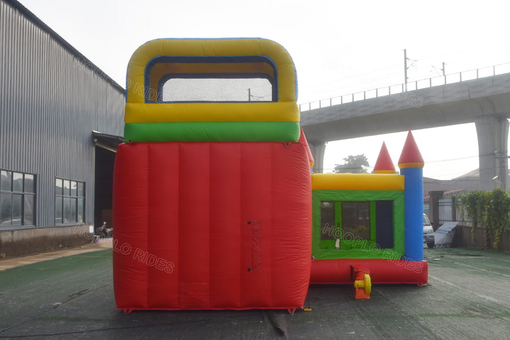 Rear back view of multicolor princess inflatable bounce house with slide combo, red blue green yellow colorful commercial jumping castle complete with air blower for kids party rental