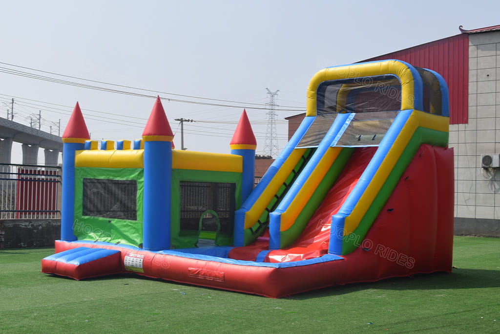 Right side full slide view of red green blue yellow princess inflatable bounce house combo, large multicolor inflatable bouncy castle for commercial rental and family backyard birthday parties