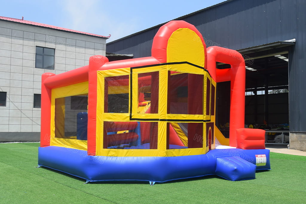 All-in-one inflatable bouncy house combo full side view, integrated slide obstacle course commercial PVC bounce castle for events