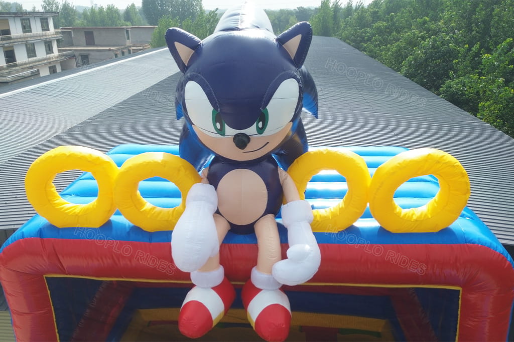 First inflation test of custom Sonic inflatable slide, inflatable Sonic figure arm squeezed against decorative ring and cannot fully inflate