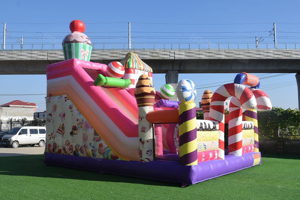 Right side view Hooplo Candy Land Inflatable Bounce House, colorful candy & dessert printing, large inflatable bouncer with climbing slides and obstacle tunnels inside