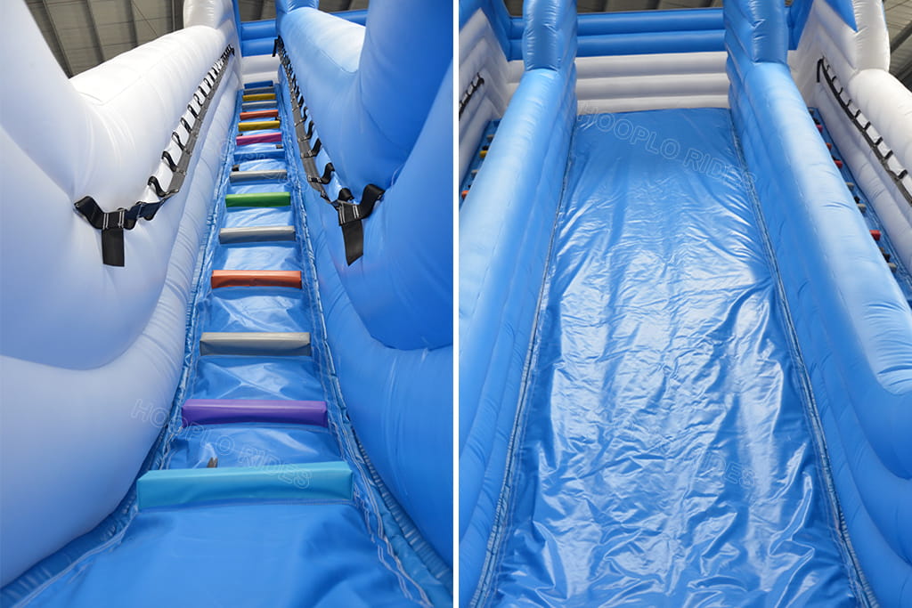 Detail view of colorful dual climbing ladder and wide smooth sliding lane on commercial beach inflatable slide