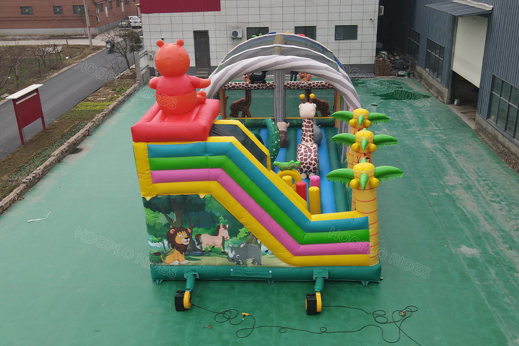 Back view mini rainbow jungle inflatable obstacle course with colorful slide, bear decoration inflatable play equipment for kids party