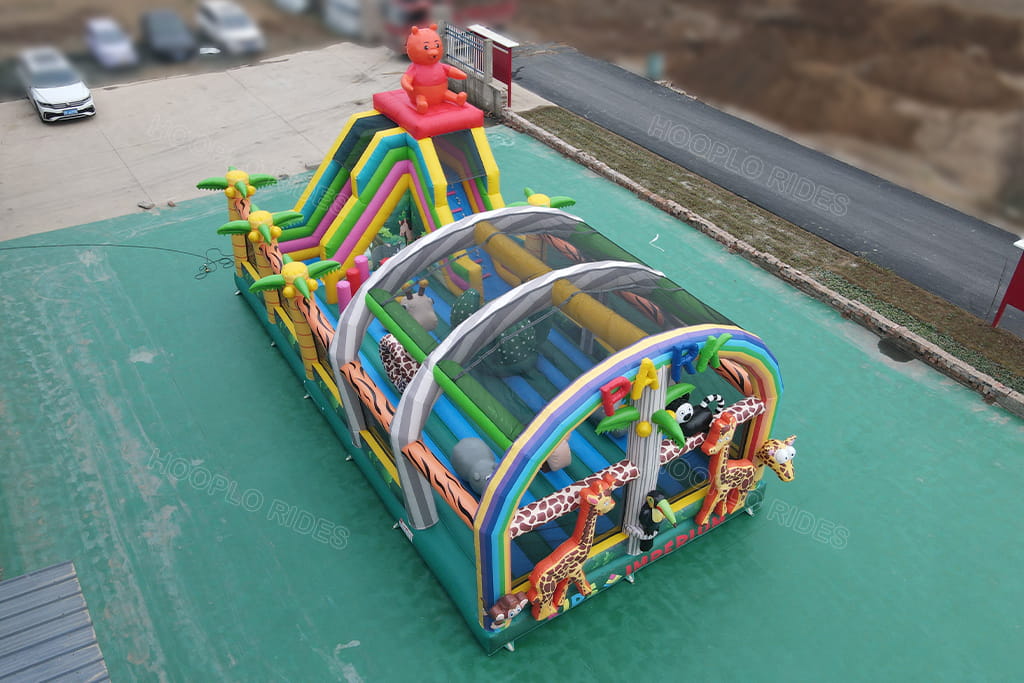 Aerial view small mini jungle park inflatable obstacle maze, rainbow arch inflatable obstacle course combined with slide for children events