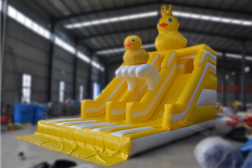 Cute yellow rubber duck inflatable double lane dry slide with crown duck decoration for kids events